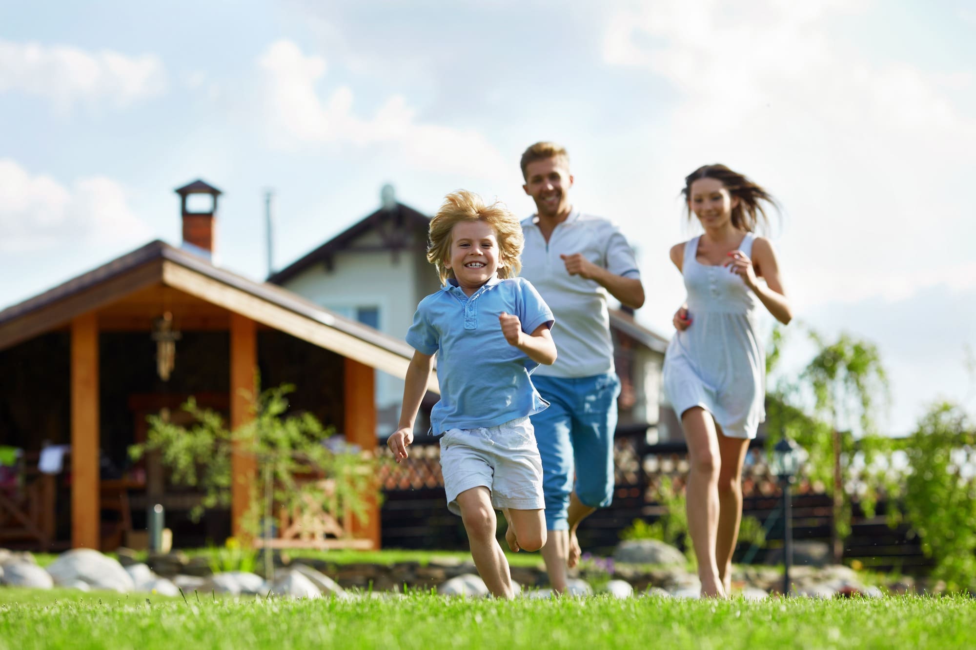 Running people on a lawn at the house
